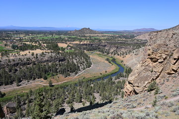 Smith Rock State Park and Crooked River near town of Terrebonne, Oregon on cloudless summer day.