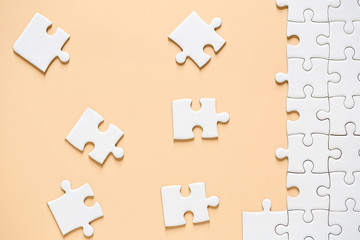 Unfinished red with white jigsaw puzzle pieces