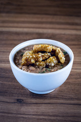 Mashed bean cracklings called Tutu de Feijao in Brazil. Brazilian beans with cabbage, large piece of pork rinds and beans. Rural food.