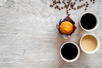 Breakfast with muffin and coffee to-go on gray background top view mockup