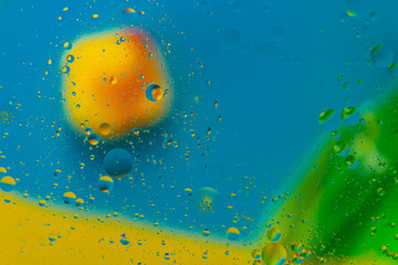 Micro molecular abstract pattern of colored oil bubbles on water. 
