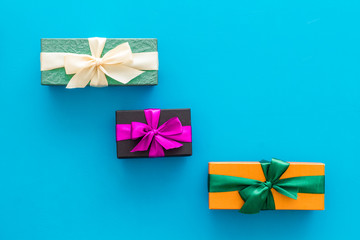 boxes with presents for holiday on blue background top view mockup