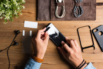 the man replacing the screen protector