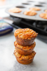 Stack of three breakfast muffins in a kitchen