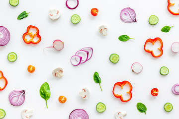 Layout of colorful vegetables on white background top view pattern