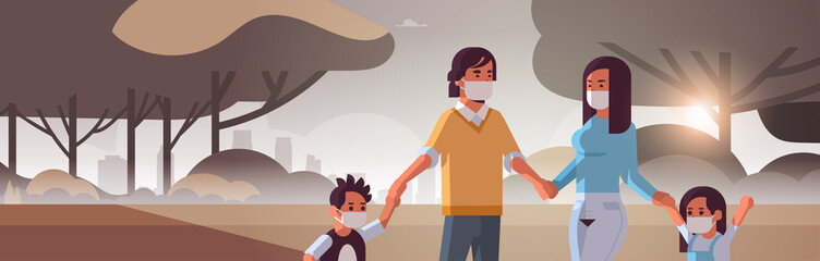 family wearing face masks toxic gas air pollution industry smog polluted environment concept parents and children walking outdoor dirty smoke landscape background portrait horizontal