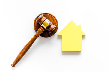 Inscribed gavel, house figure for inheritance concept on white background top view