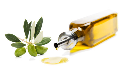 Olive oil in bottle and fresh olives.