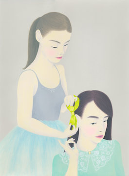 Woman styling hair of her friend