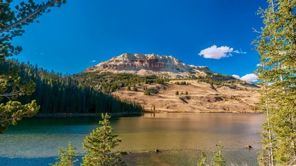 A beautiful American landscape scene, with Beartooth Lake and the ancient geological formation of Beartooth Butte in the background, located in Wyoming, USA.