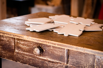 Group of creative friends playing in card game on the wool table. People enjoy a vacation together.   Card game on the wool table. Enjoy a vacation together.  Puzzle game on the table.
