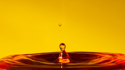 Splashing water droplets and orange waves