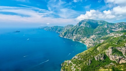 Fototapeta na wymiar Panorama of the beautiful Amalfi Coast in Italy during summer, with vibrant blue water and sky, taken from the Path of the Gods hiking trail.