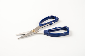 Blue scissors isolated on white background