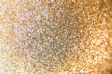 Golden beautiful blurred bokeh background with copy space. Shiny background. Wallpaper for web design. Christmas theme or other design. Holiday texture