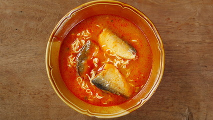red chili noodle soup, Japanese Ramen and fish, tomato sauce in a bowl