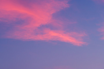 Naklejka na ściany i meble Blue and pink cloudy sky background.