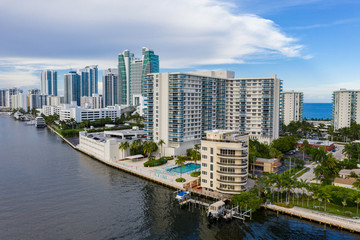 Fototapeta na wymiar Hollywood Beach Florida condominium apartment buildings by Intracoastal Waterway aerial drone shot