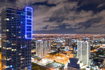 Naklejka premium Highrise condominium with bright neon lights