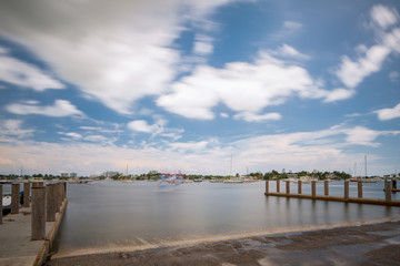 Fototapeta na wymiar Photo of a boat ramp in Miami. Long exposure creating motion blur in sky