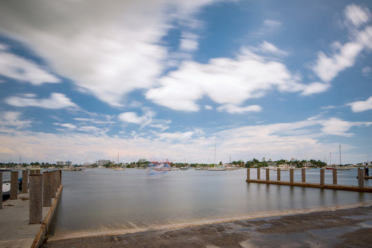 Photo of a boat ramp in Miami. Long exposure creating motion blur in sky