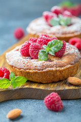 Delicious mini-tarts (tartlets) with raspberries.