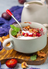 Red cherry plum crumble for healthy breakfast.