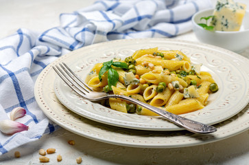 Delicious pasta with green peas and blue cheese.