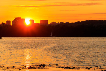 Orange sunset over a river in Kiev, Ukraine