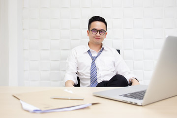 Fototapeta premium Asian businessman's portrait. Workaholic and hard working people concept.