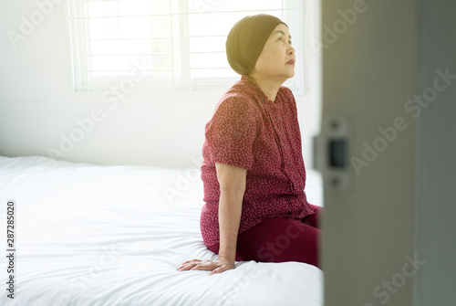 Senior Asian Woman With Disease Cancer Sitting In Her
