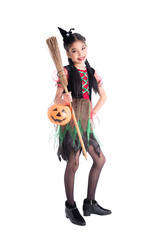 Full length of asian girl in witch costume holding bloom and halloween pumpkin bucket,standing with smile over white background