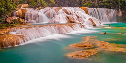 Panoramic photograph and long exposure of the Agua Azul cascades and waterfalls in the tropical rainforest of Chiapas state near the city of Palenque, Mexico.