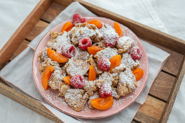 Kaiserschmarrn - traditional austrian pancake dessert with fresh fruit