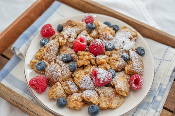 Kaiserschmarrn - traditional austrian pancake dessert with fresh fruit