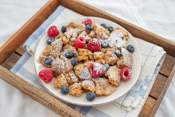 Kaiserschmarrn - traditional austrian pancake dessert with fresh fruit