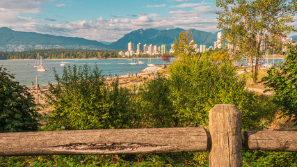 Driftwood-strewn Beach at Kitsilano Looking Across Bay to Stanley Park and North Shore Mountains