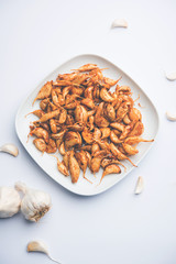 Garlic Fry or Tala Hua Lahsun in hindi, is a popular side dish or snacks from maharashtra, India