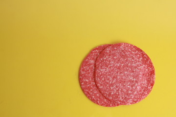 slices of salami in colorful background