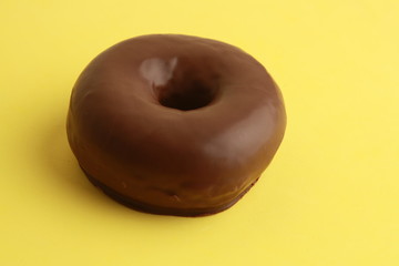 chocolate bagel on colorful background
