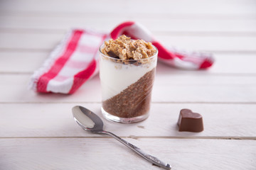 Delicious breakfast, cocoa chia pudding with yogurt and cereals