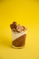 Delicious breakfast, cocoa chia pudding with yogurt and cereals