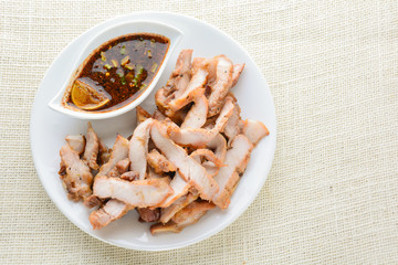 Grilled Pork with Thai Spicy Sauce, it can be served as an appetizer; it can also be served as an entrée with hot-off-the-splatter-guard sticky rice or plain steamed jasmine rice.