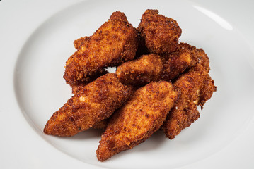 chicken nuggets on the white plate