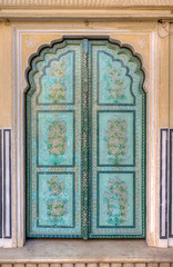 Close up of ornate architecture on door at Hawa Mahal ("Palace of Winds" or "Palace of the Breeze") - a palace in Jaipur, India.