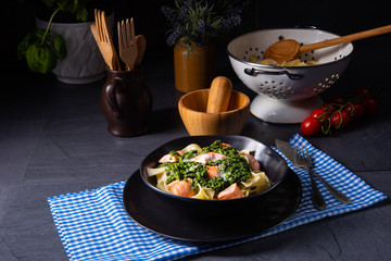 pappardelle pasta with creamed spinach and fried salmon