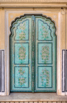 Close up of ornate architecture on door at Hawa Mahal ("Palace of Winds" or "Palace of the Breeze") - a palace in Jaipur, India.