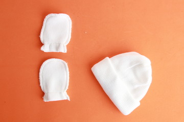 white wool hat and mittens for baby
