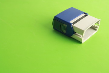 Fototapeta premium Automatic ink stamp manufactured in blue plastic