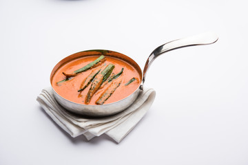 Hyderabadi Bhindi ka Salan or Okra salan made using ladies' fingers or ochro. Main course recipe from India. served in a bowl. selective focus